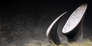 An abstract curved form with a slow spiral of light in the dark.
